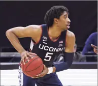  ?? Rich Schultz / Getty Images ?? UConn coach Dan Hurley calls Isaiah Whaley an ‘invaluable’ member of the Huskies.