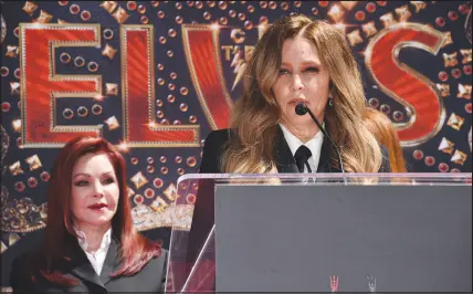  ?? JORDAN STRAUSS/INVISION 2022 ?? Priscilla Presley, former wife of the late singer Elvis Presley, left, looks on as her daughter, Lisa Marie Presley, speaks during a ceremony last summer in Los Angeles. Lisa Marie, who died Jan. 12 at age 54, was the sole beneficiar­y of her father’s estate after his death in 1977.