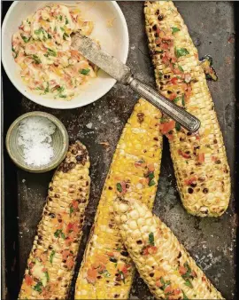  ?? CONTRIBUTE­D BY STEVE LEGATO ?? Grilled corn is delicious on its own, but this version from “Red, White, and ‘Que: FarmFresh Foods for the American Grill” by Karen Adler and Judith Fertig is spiced up with a pepper butter.