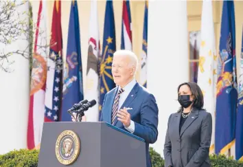  ?? ALEX BRANDON/AP ?? With Vice President Kamala Harris looking on, President Joe Biden speaks about the American Rescue Plan, the $1.9 trillion coronaviru­s relief package he signed into law this week, during an event Friday at the Rose Garden.