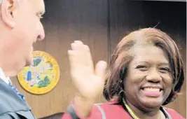  ?? BRITTANY WALLMAN/STAFF ?? Above, Brenda Forman is sworn in as Broward Clerk of Court in January. Left, Howard Forman, who joined the Broward County Commission in 1976, is sworn in again in 1983.