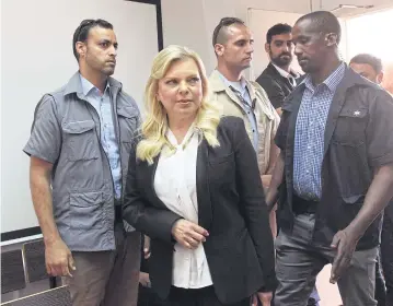  ?? AP ?? Sara Netanyahu, the wife of Israeli Prime Minister Benjamin Netanyahu, arrives in the Magistrate Court on Sunday for a hearing on a plea deal over the misuse of state funds for meals at the premier’s residence in Jerusalem.