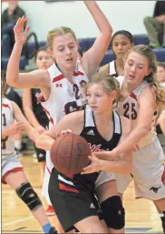  ?? Scott Herpst ?? Saddle Ridge’s Alivia Hughes (left) and Macee Castell (right) look to trap Lakeview’s Brylee Pritchett following an offensive rebound during a game last week in Rock Spring.