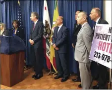  ??  ?? Los Angeles County District Attorney Jackie Lacey (sixth from left) speaks during a news conference in Los Angeles, on Monday. AP PHOTO/BRIAN MELLEY