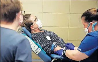  ??  ?? Heather Tucker with the Oklahoma Blood Institute prepares to draw blood from Denise Freeman during a mobile blood drive at Reaves Park in Norman on Wednesday. OBI will be at Reaves Park in Norman again Thursday, from noon to 6 p.m. [BRYAN TERRY/ THE OKLAHOMAN]