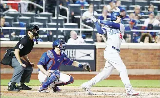  ??  ?? Cody Bellinger #35 of the Los Angeles Dodgers hits a Grand Slam against Zack Wheeler #45 of the New York Metsduring their game at Citi Field on June 22, in New York City. (AFP)