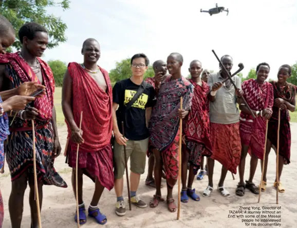  ??  ?? Zhang Yong, Director of TAZARA: A Journey Without an End, with some of the Massai people he interviewe­d for his documentar­y