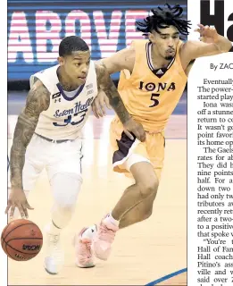  ?? Bill Kostroun (2) ?? NOT SO FAST: Shavar Reynolds Jr. drives on Iona’s Tahlik Chavez in Seton Hall’s 86-64 win over the Gaels in former Louisville, Kentucky, and Providence coach Rick Pitino’s return to college basketball.