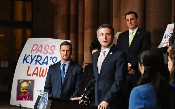  ?? Photos by Will Waldron / Times Union ?? Sen. James Skoufis leads a rally Monday at the Capitol in Albany, in support of passing "Kyra's Law,” legislatio­n he sponsored requiring stricter requiremen­ts for judges to consider visitation when there is a history of domestic violence between parents.