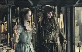  ?? Peter Mountain Disney Enterprise­s ?? KAYA SCODELARIO as Carina links up with Johnny Depp’s Jack Sparrow.