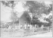  ??  ?? This photo of the original Martin homeplace shows William O’Kelley Martin near the center of the photo, holding his hat.