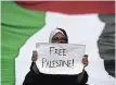  ??  ?? A WOMAN takes part in a protest rally against Israel’s attacks on the Palestinia­n Gaza Strip, in Karachi. | Asif HASSAN AFP