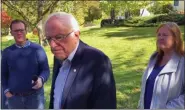  ?? WILSON RING - THE ASSOCIATED PRESS ?? In this image taken from video, Democratic presidenti­al candidate Sen. Bernie Sanders, I-Vt., speaks we reporters outside his home, Tuesday, in Burlington, Vt. His wife, Jane O’Meara Sanders listens at right. Sanders says he was “dumb” not to have listened to the symptoms he was experienci­ng before he was stricken with a heart attack last week.