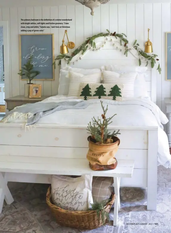  ?? ?? The primary bedroom is the definition of a winter wonderland with bright whites, soft lights and festive greenery. “I love clean, crisp and white,” Tamela says, “and I love at Christmas adding a pop of green color.”