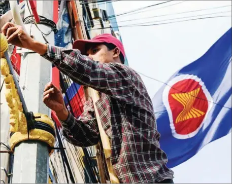  ?? AFP ?? Enhanced ASEAN identity can be achieved in part through efforts to promote ASEAN visibility such as with the increased use of the ASEAN flag, logo and anthem.
