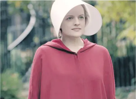  ??  ?? Elisabeth Moss stars as Offred in The Handmaid’s Tale. Series music supervisor Maggie Phillips is compiling a playist for the character.