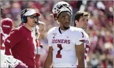  ?? JEFFREY MCWHORTER - THE ASSOCIATED PRESS ?? Oklahoma head coach Lincoln Riley, left, could be looking at a reunion with former quarterbac­k Jalen Hurts, seen during a game Oct. 12, 2019, if the Eagles choose to move on from Doug Pederson after this playoff-less season.