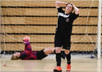  ??  ?? Rebecca Doddy of St. Attracta’s Community School reacts after seeing her penalty saved by Amy Noonan of Presentati­on Secondary School during the penalty-shoot.