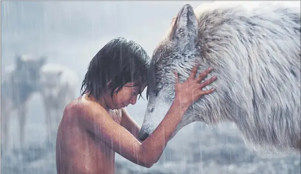  ??  ?? RAISED BY WOLVES: A moving scene between Mowgli (Neel Sethi) and Raksha (voiced by Lupita Nyong’o) in The Jungle Book. It is not all sentimenta­l, the fur flies when there’s a fight to be had. Picture: PA/Disney