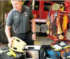  ?? TIMES photograph by Annette Beard ?? Capt. Dustin McDonald shows some of the equipment on the new advanced life support ambulance for Pea Ridge Fire/EMS Dept. Pea Ridge Fire/EMS received certificat­ion for an advanced life support (ALS) ambulance Tuesday, April 1.