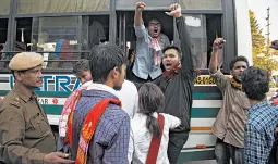  ?? ANUPAM NATH/AP ?? Protesters of the Citizenshi­p Amendment Bill are detained Wednesday in Gauhati, India.