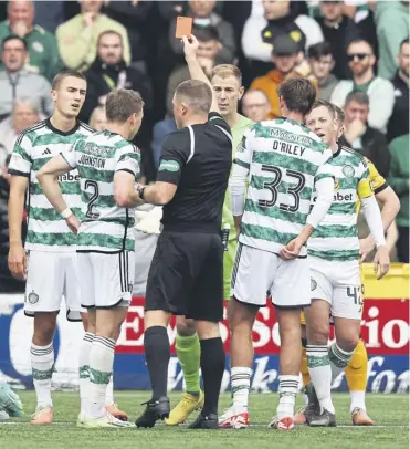  ?? ?? Joe Hart is shown a red card by referee John Beaton during Celtic’s win at Livingston last September