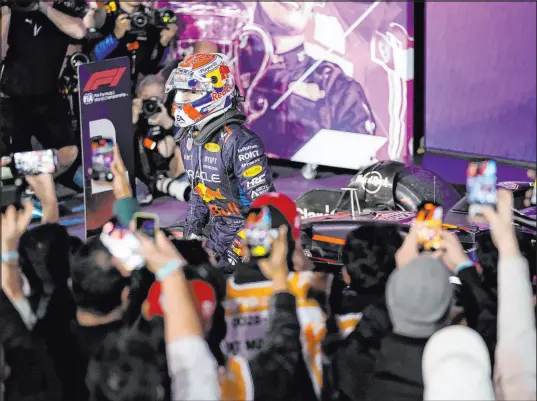  ?? Darko Bandic The Associated Press ?? Picking up where he left off last season, Max Verstappen of the Netherland­s was the center of attention, starting on the pole and collecting a 22-second victory at the Bahrain Grand Prix in Sakhir. Sergio Perez gave Red Bull a one-two finish.
