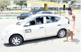  ?? FILE ?? In this March photo, a female was turned away by the taxi driver as she would have been the fourth passenger in a cab which runs from Papine to downtown Kingston.