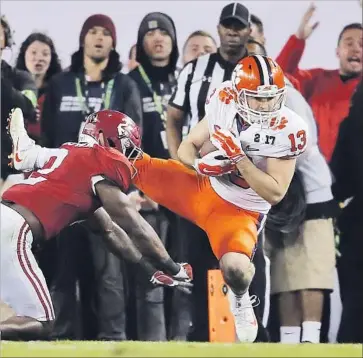  ?? John Bazemore Associated Press ?? THE LAST of Clemson sophomore Hunter Renfrow’s 10 catches was short, two yards, and perhaps the sweetest in Tigers history. It went for the winning touchdown with one second left in national championsh­ip game.