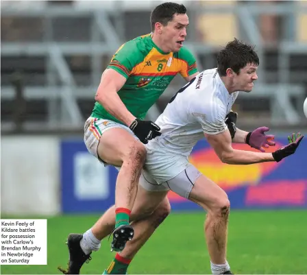  ??  ?? Kevin Feely of Kildare battles for possession with Carlow’s Brendan Murphy in Newbridge on Saturday