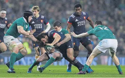  ??  ?? Ireland’s Johnny Sexton, back in action after injury, tackles Remi Lamerat