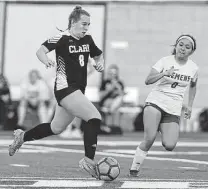  ?? ?? Clark’s Emily Hight, left, dribbles against Clemens’ Gabi Morales on Friday. Hight also scored three goals.