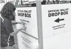  ?? JEFFREY F. BILL/CAPITAL GAZETTE ?? Dan Oltman, precinct and polling place manager, prepares a ballot dropbox last month. Annapolis voters can return their ballots to ballot dropboxes located at each voting precinct in the city for the upcoming primary election.