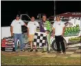  ?? RICK KEPNER - FOR DIGITAL FIRST MEDIA ?? Doug Manmiller, second from right, celebrates in victory lane after his modified win on Saturday night at Grandview Speedway.