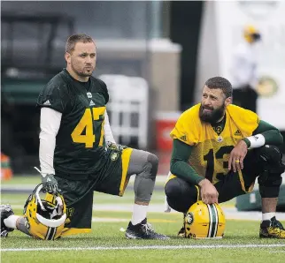  ?? GREG SOUTHAM ?? J.C. Sherritt, left, and the Edmonton Eskimos’ defence are doing their best to give quarterbac­k Mike Reilly and the offence a lift as they chase a playoff berth with the team fifth in the West Division standings.