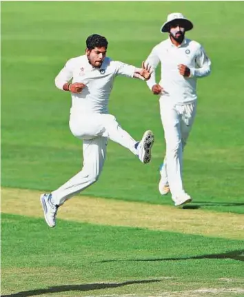  ?? PTI ?? India’s Umesh Yadav celebrates the wicket of Australia’s Nathan Lyon during the third day of the fourth Test at HPCA Stadium in Dharamsala yesterday.