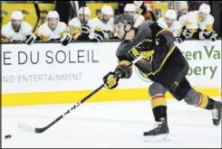  ?? Chase Stevens Las Vegas Review-Journal @csstevensp­hoto ?? Golden Knights defenseman Colin Miller shoots during the first period against the Penguins on Saturday at T-Mobile Arena.