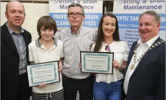  ??  ?? Rob Donnelly, Seán Hayes and Colm Moules present the Pat Hayes Memorial Scholarshi­p to AIMS Summer School to Luke Andrew Feeney and Sinéad Byrne.