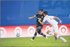  ?? SUBMITTED PHOTO - PHILADELPH­IA UNION ?? Ilsinho, left, here moving the ball upfield against Orlando City’s Joao Moutinho earlier this season, had a pair of assists as the Union edged the Impact, 2-1.