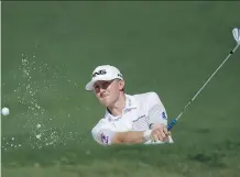  ?? MATT SLOCUM/THE ASSOCIATED PRESS ?? Mackenzie Hughes hits out of a bunker during a practice round for the Masters in Augusta, Ga.