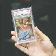  ??  ?? Sasha Tamaddon says he offered a seller $5,025 in cash in addition to several other cards for this 2018 Shohei Ohtani autographe­d Topps Chrome Gold Refractor. At the height of the trading card boom, a mint-condition Fleer Michael
Jordan rookie card sold for more than $700,000.