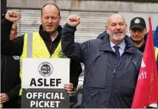  ?? ?? Walkout: Aslef’s Mick Whelan, right, on the picket line