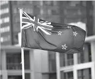  ?? Bloomberg photo by Brendon O’Hagan ?? ■ The New Zealand flag flies in 2016 in Auckland, New Zealand.