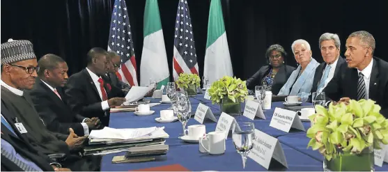  ?? /Bloomberg ?? Open for business: Former US president Barack Obama, right, seen here with former US secretary of state John Kerry, second right, and Nigerian President Muhammadu Buhari, left, supported Agoa.