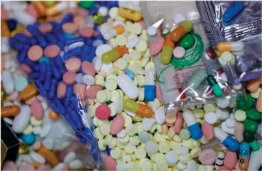  ?? AP PHOTO BY KEITH SRAKOCIC ?? Medication­s that are stored in the police headquarte­rs that are slated for destructio­n, are shown in a locked storage area, Wednesday, Sept. 11, in Barberton, Ohio. Attorneys representi­ng some 2,000 local government­s said Wednesday they have agreed to a tentative settlement with Oxycontin maker Purdue Pharma over the toll of the nation’s opioid crisis.