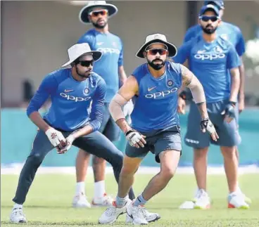  ??  ?? India captain Virat Kohli (R) with Hardik Pandya at their training session in Galle on Tuesday.