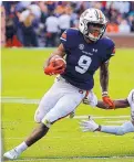  ?? BUTCH DILL/ASSOCIATED PRESS ?? Auburn running back Kam Martin will be trying to gain yards against topranked Alabama on Saturday in the Iron Bowl.