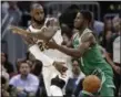  ?? TONY DEJAK — THE ASSOCIATED PRESS ?? LeBron James passes against the Celtics’ Semi Ojeleye in the first half.