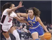  ?? CHASE STEVENS — THE ASSOCIATED PRESS ?? UCLA guard Kiki Rice (1) drives to the basket under pressure from Stanford guard Haley Jones (30) during the first half in the semifinals of the Pac-12tourname­nt Friday in Las Vegas.