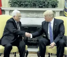  ?? EVAN VUCCI/THE ASSOCIATED PRESS ?? U.S. President Donald Trump shakes hands with with Palestinia­n leader Mahmoud Abbas during their meeting in the Oval Office of the White House, Wednesday, in Washington.